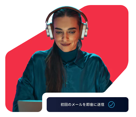 Woman in headphones using a laptop with a prompt to send the first email instantly