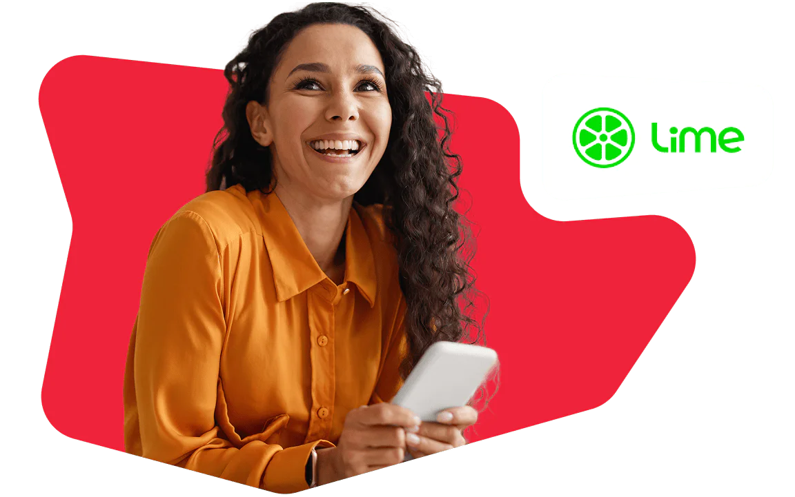 Smiling woman in an orange shirt holding a smartphone, with Lime logo in the background.