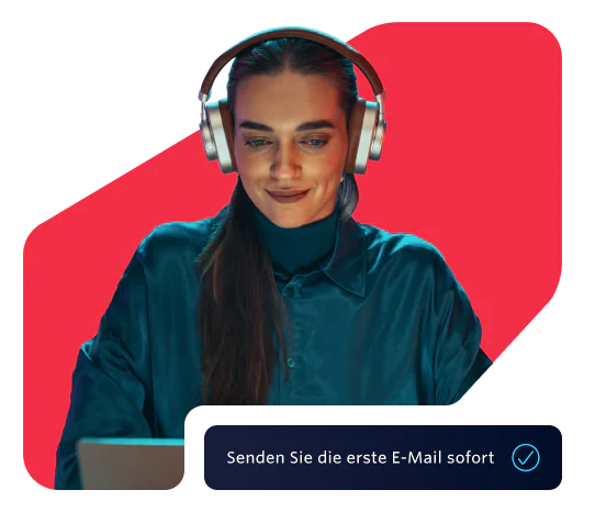 Woman in headphones using a laptop with a prompt to send the first email instantly