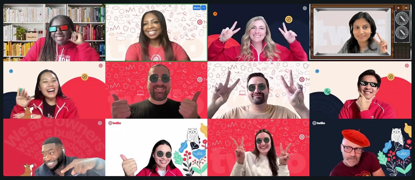 Group of twelve people in a virtual meeting, smiling, laughing, and showing thumbs-up on screen.