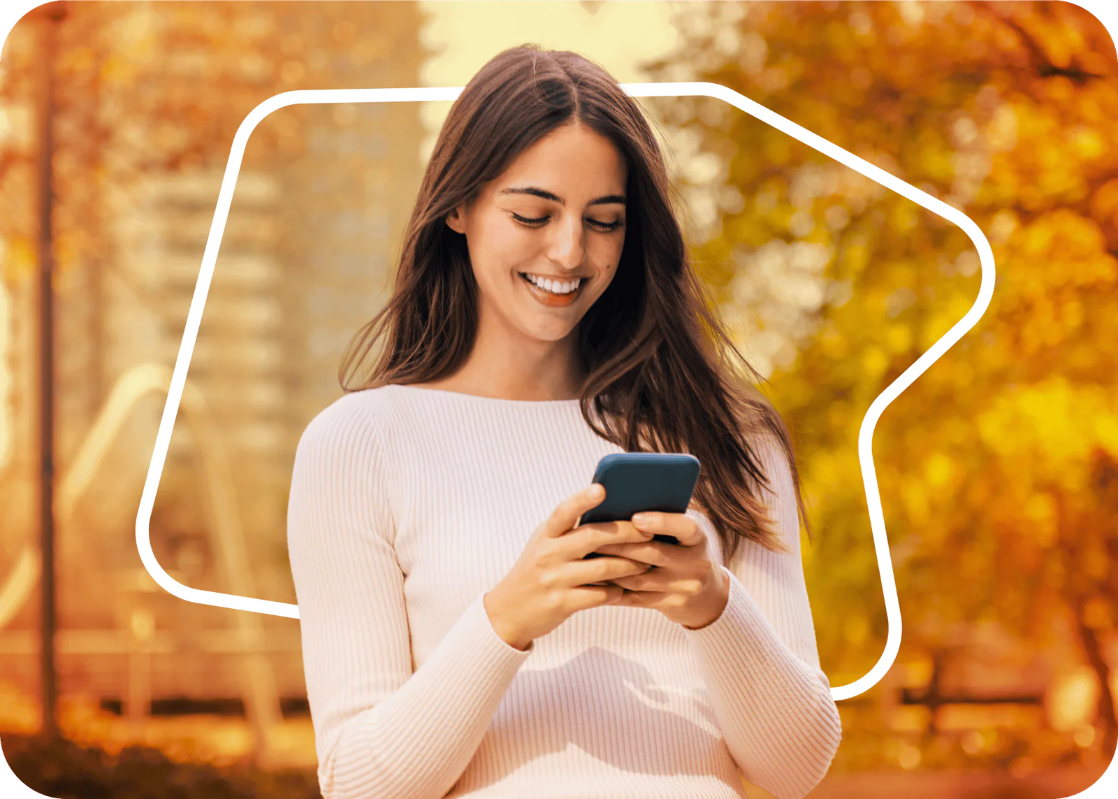 Standing woman smiling looking at phone