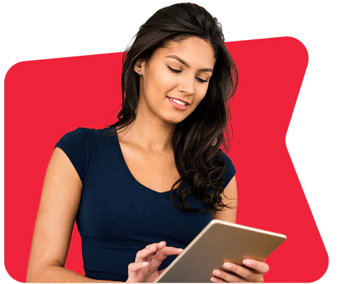 A woman in a navy blue shirt uses a tablet against a red geometric background.