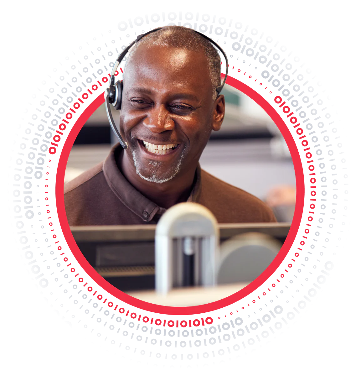 Smiling man wearing a headset in an office setting, surrounded by binary code