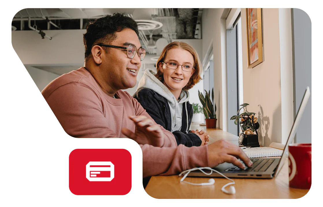 A man at a computer desk testing the Twilio AI Assistants feature in a beta environment.