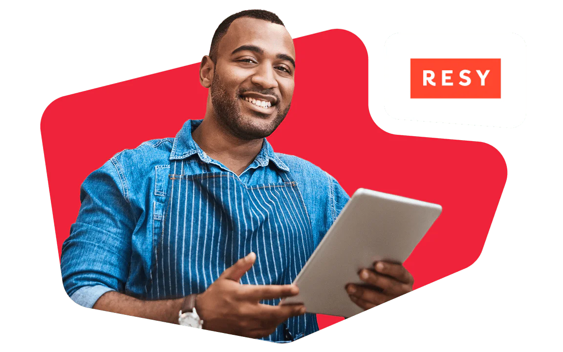Man wearing a denim shirt and apron holding a tablet, standing in front of a red background with RESY logo.