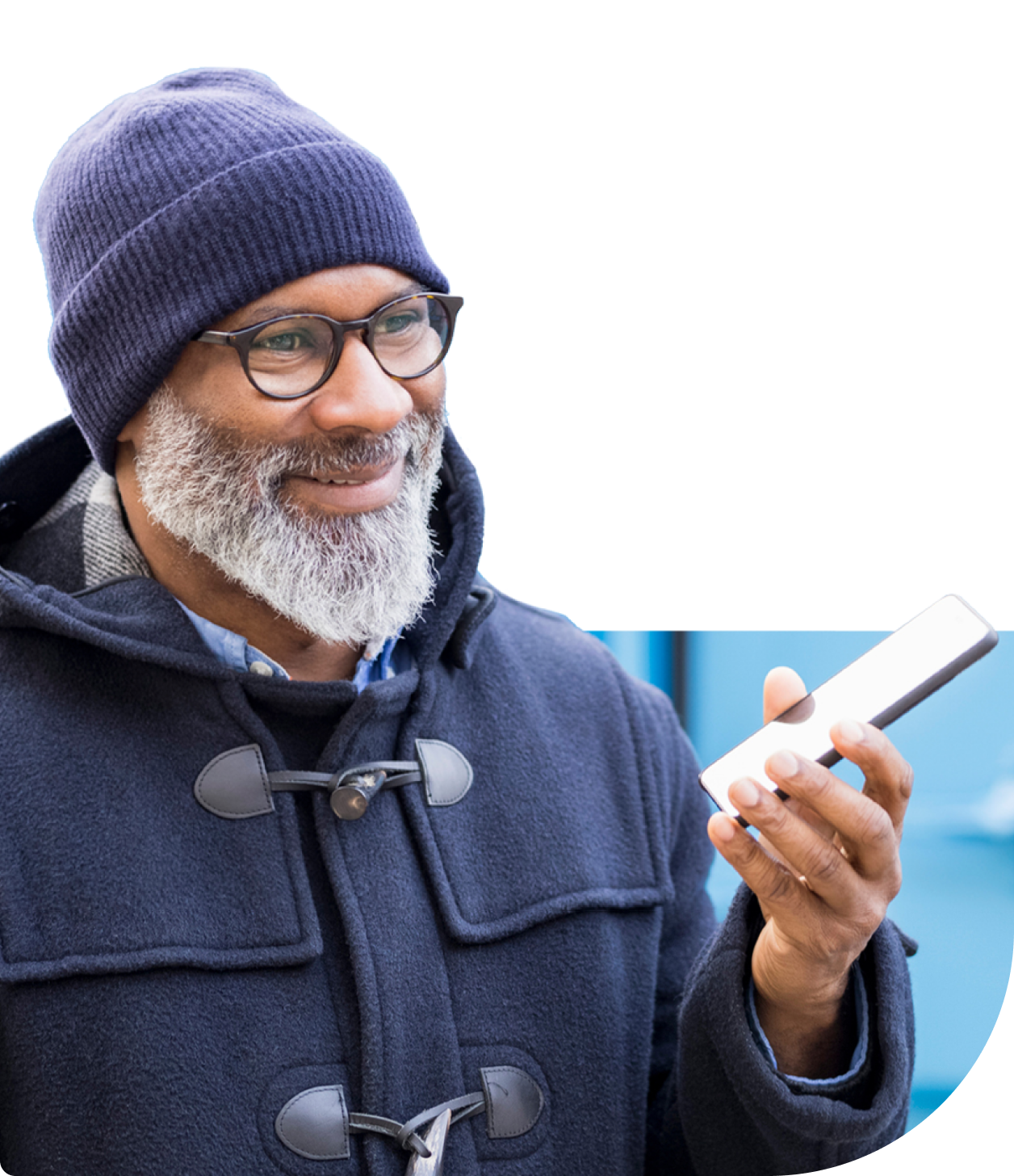 Un homme avec un t&eacute;l&eacute;phone et un bonnet.