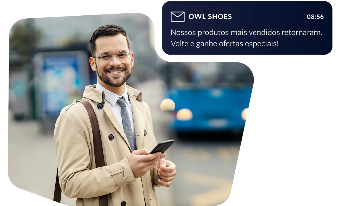 Man wearing glasses in a beige coat holding a phone, with a summer sale email notification visible.